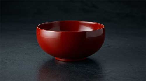 Objeto de laca Urushi japonesa con acabado brillante y profundo